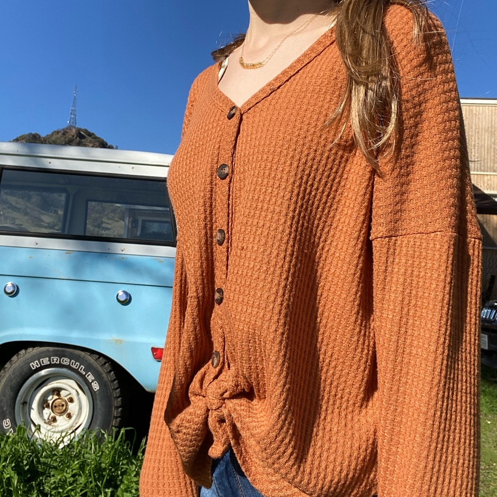 Tillys orange button up top